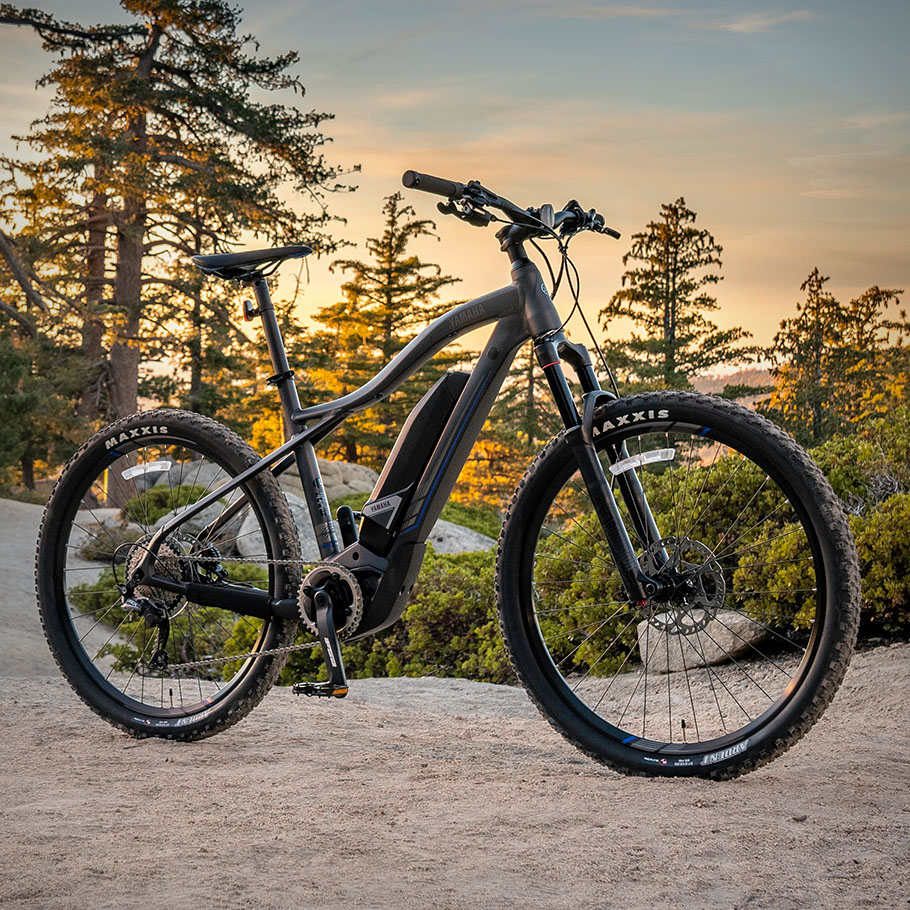 yamaha-power-assist-bicycles-2020-ydx-torc-flat-black-outdoors-sunset.jpg